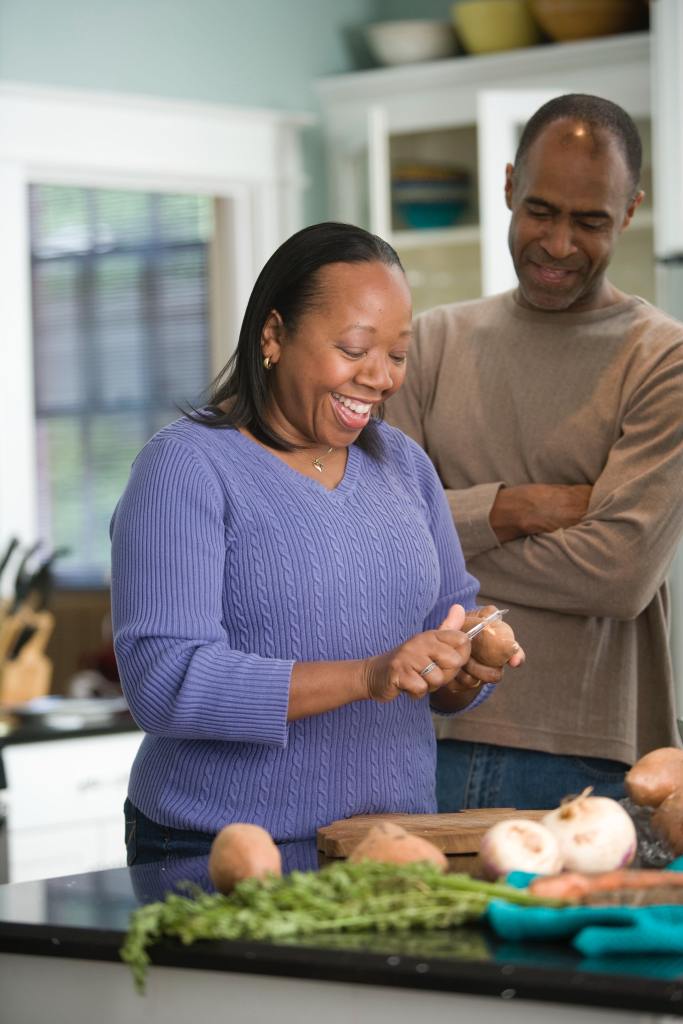 Couple preparing a meal at home.